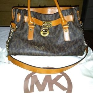 An Authentic Michael kors purse.